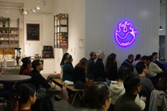 Attendees seated for a talk at an Experience Cafe evening