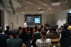 An Experience Cafe talk in a Berlin lecture room