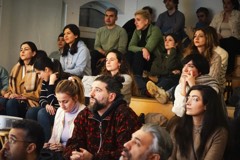 Attendees listening at an Experience Cafe meetup