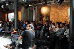 An Experience Cafe session in a brick-walled Berlin venue