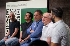 A panel taking questions at an Experience Cafe event